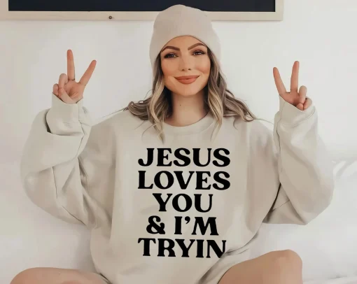 Jesus Loves You And I'm Tryin Unisex Sweatshirt